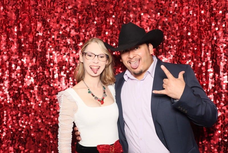 guests in photo booth at wedding