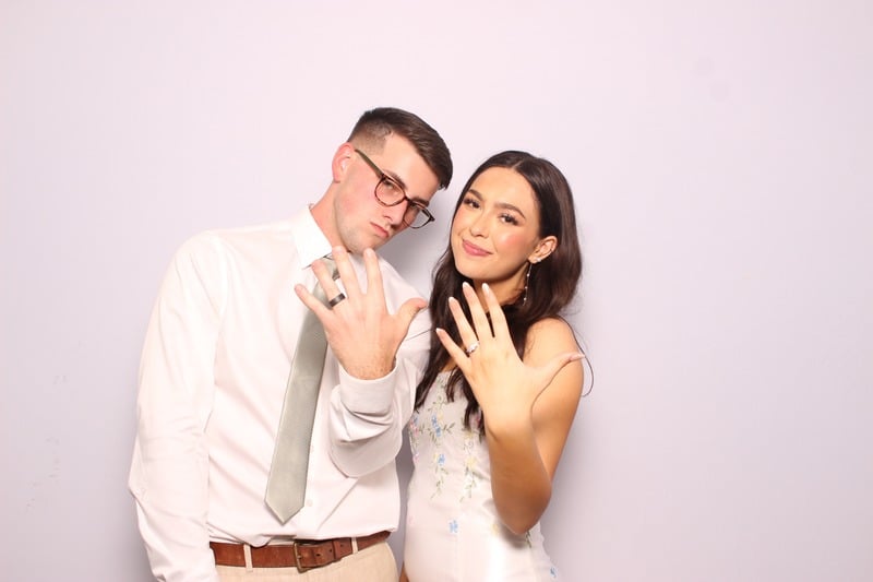 bride and groom in photo booth